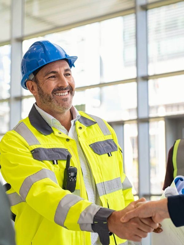 mature-architect-and-contractor-shaking-hands-at-construction-site-r2cjuaophclidiui2gc257uy4ynlpzciu5dqmlo6rk